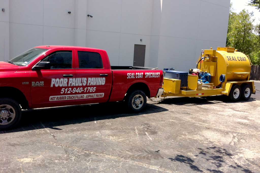 Poor Paul's paving work truck and sealcoating installation.